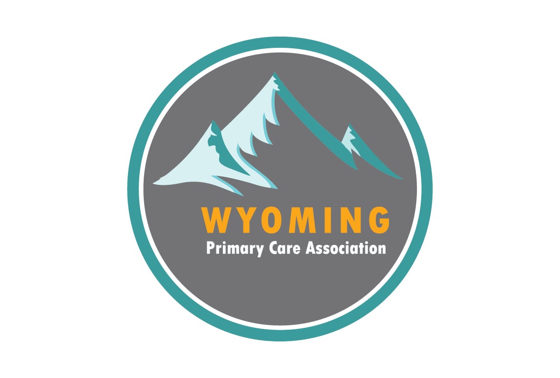 A circular logo with teal and gray borders features stylized turquoise mountains and the text “WYOMING Primary Care Association” in yellow and white on a gray background.