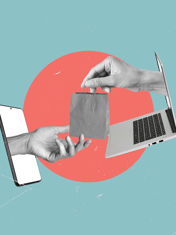 A hand extends from a smartphone screen, taking a small paper bag from another hand reaching out of a laptop, symbolizing online shopping and digital transactions, with a red circle on a blue background.